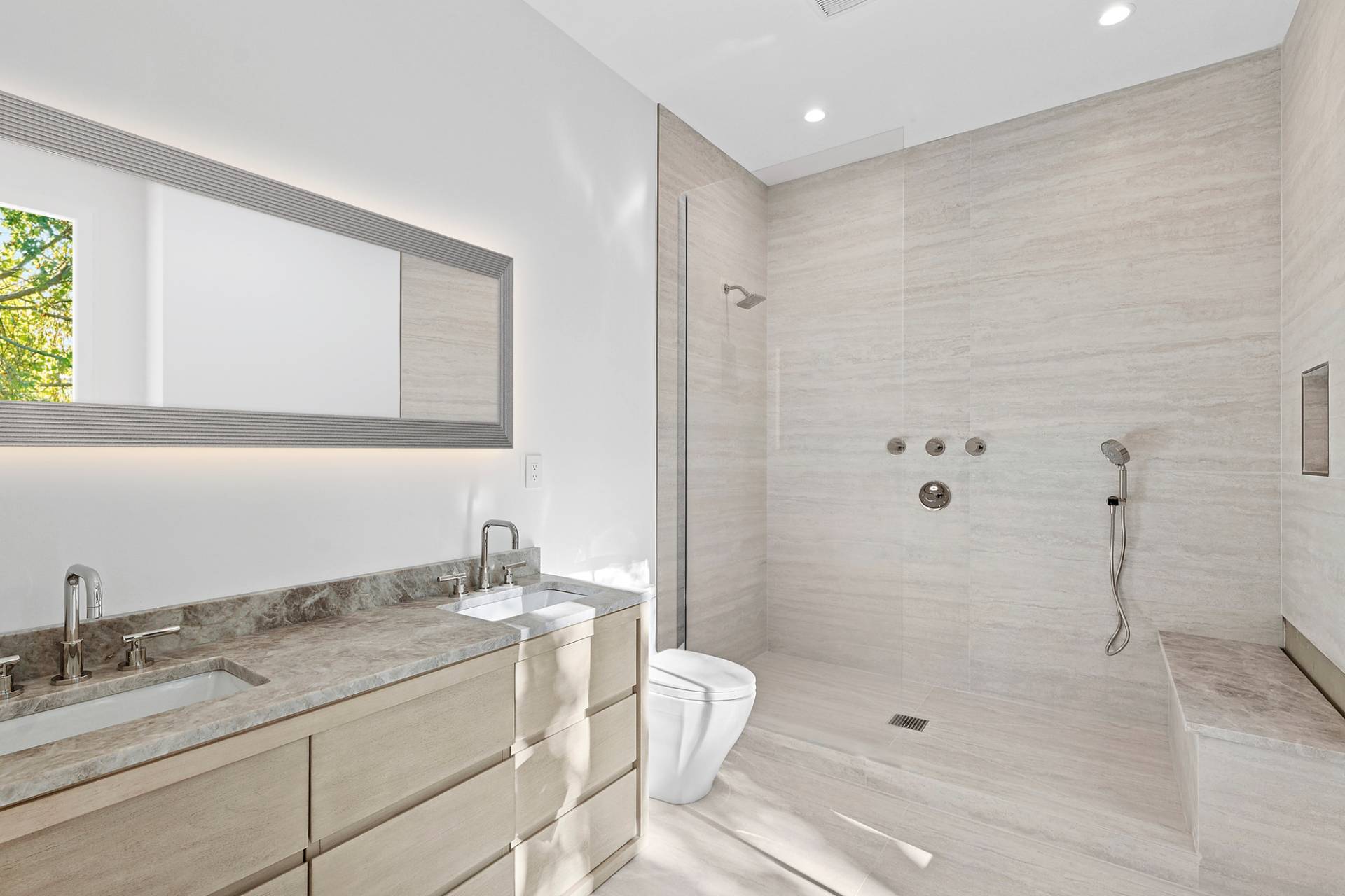 126 Long Lane East Hampton, NY 11937 - Photo 12 of 26 a bathroom with a granite countertop sink a mirror and shower