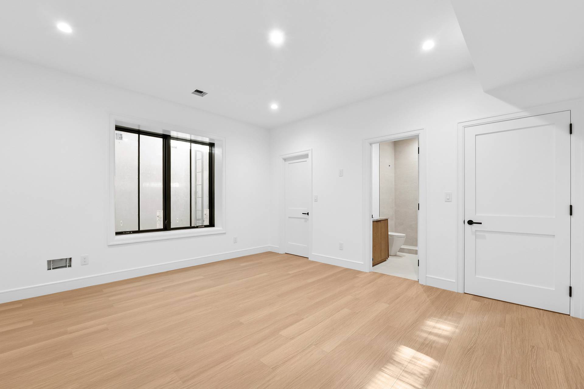 126 Long Lane East Hampton, NY 11937 - Photo 18 of 26 a view of an empty room with window and wooden floor