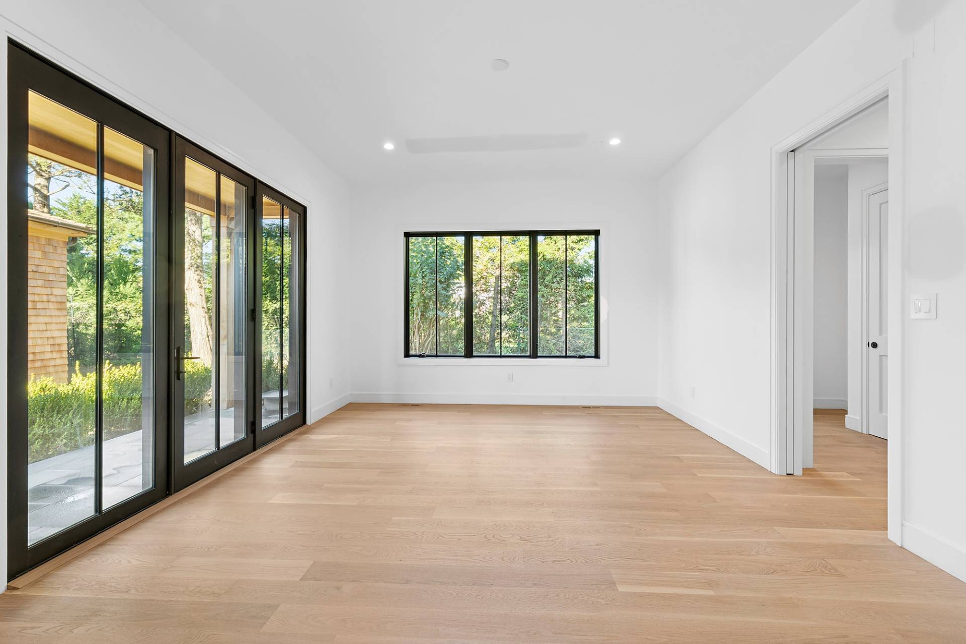 126 Long Lane East Hampton, NY 11937 - Photo 5 of 26 a view of an empty room with large windows