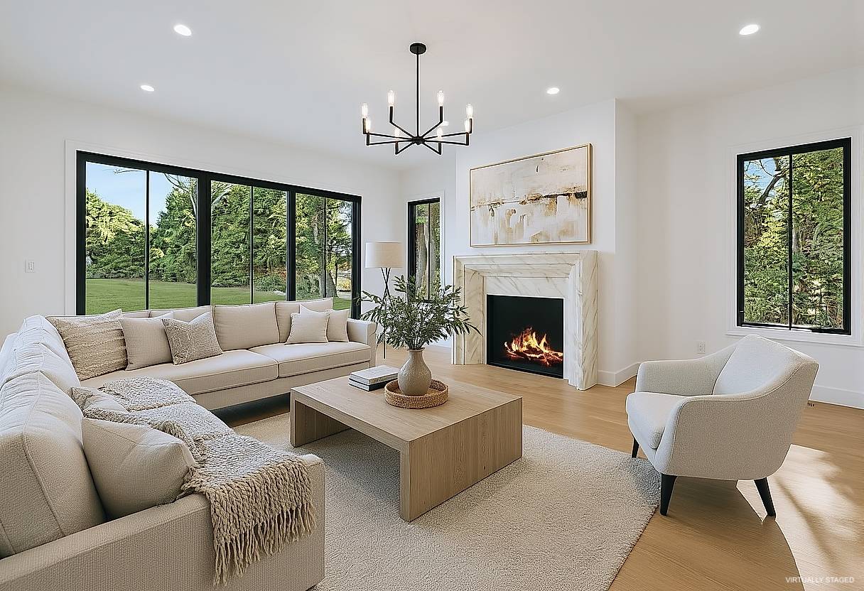 126 Long Lane East Hampton, NY 11937 - Photo 9 of 26 a living room with furniture a chandelier and a fireplace