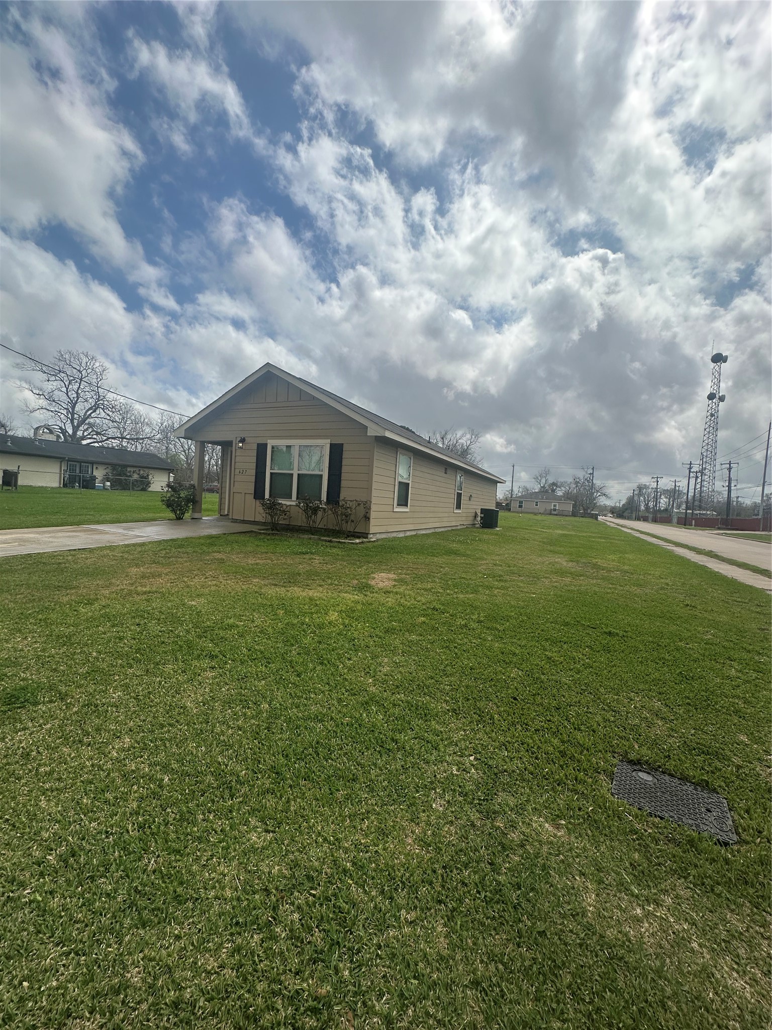 627 West Live Oak Street Angleton, TX 77515 - Photo 3 of 12 a view of a big yard with table and chairs under an umbrella