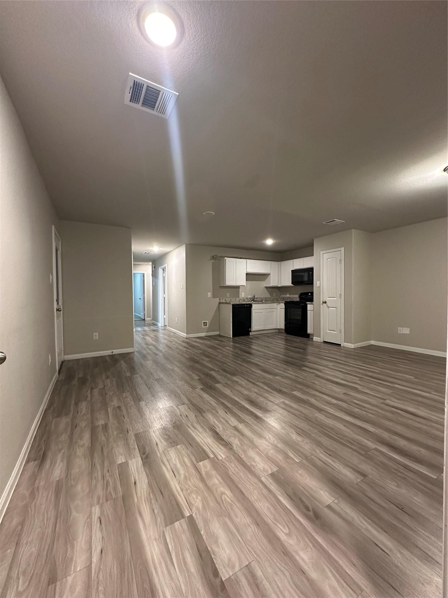 627 West Live Oak Street Angleton, TX 77515 - Photo 4 of 12 a view of empty room with wooden floor