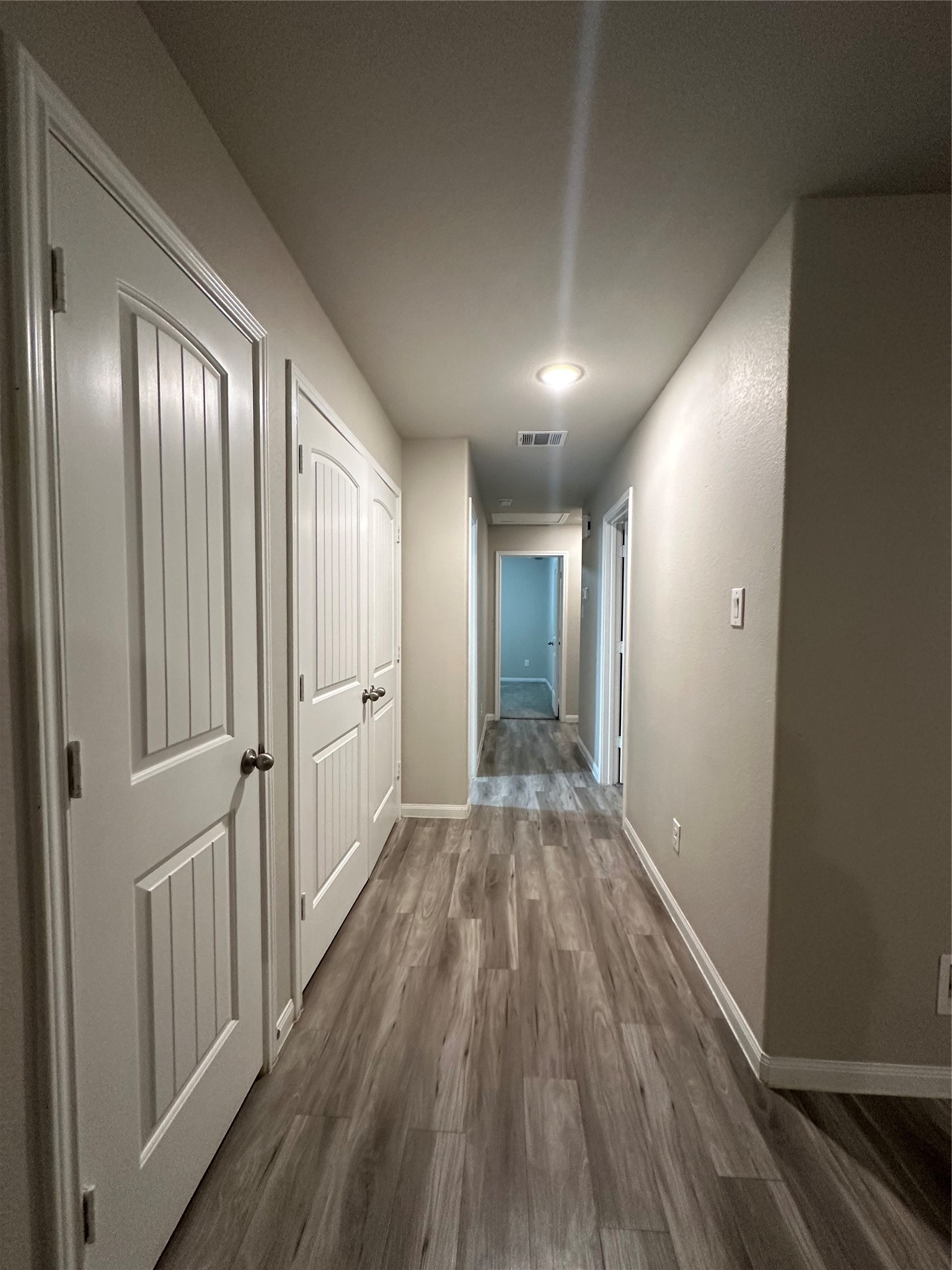 627 West Live Oak Street Angleton, TX 77515 - Photo 7 of 12 a view of a hallway with wooden floor