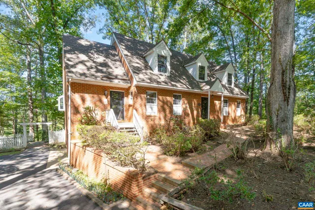 a living room with furniture a fireplace and a table