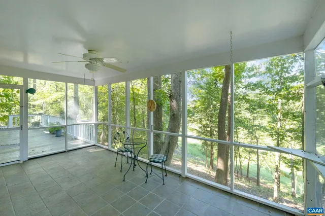 a kitchen with center island table and chairs in it