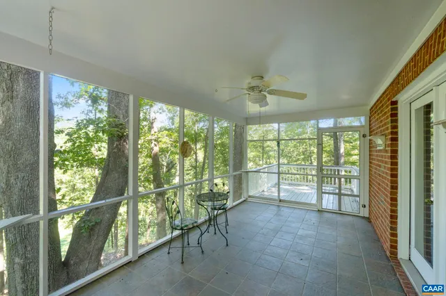 a kitchen with a stove a sink dishwasher and a refrigerator with wooden floor