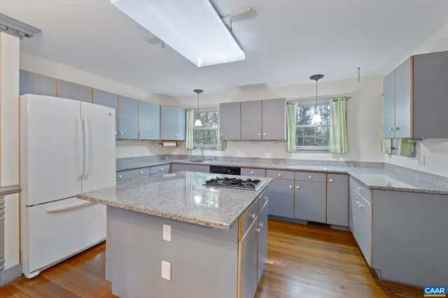 a view of an empty room with a fireplace