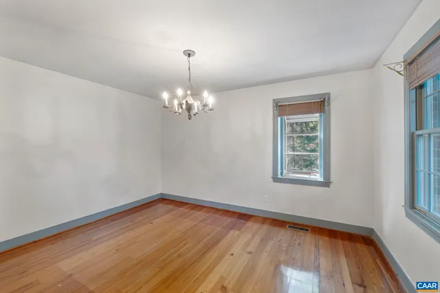 a view of empty room with floor to ceiling window