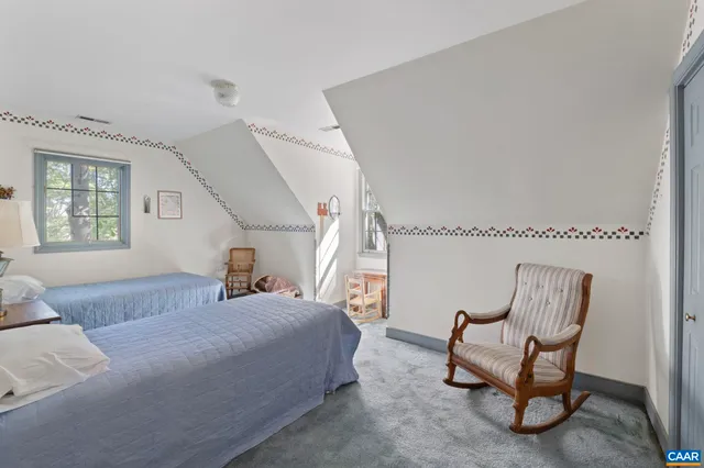 a backyard of a house with yard and outdoor seating