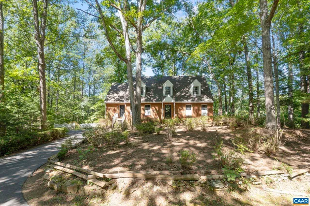a view of a house with brick walls