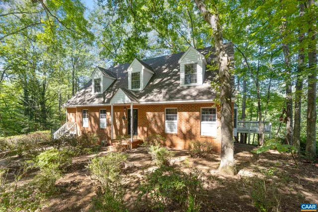 a view of a hallway with seating area