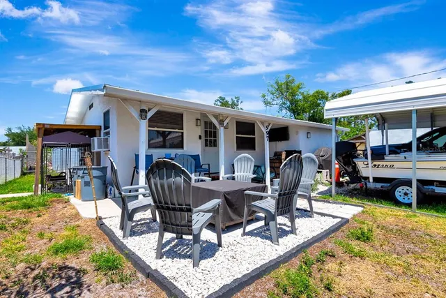 a view of a house with backyard porch and patio