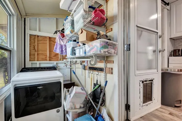 a kitchen with stainless steel appliances a refrigerator and a wooden cabinets