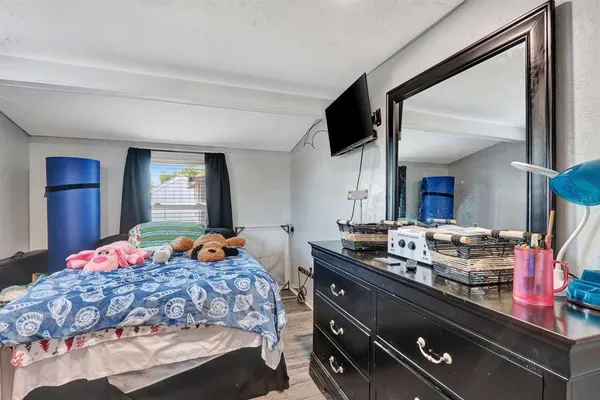 a view of a swimming pool and lounge chairs