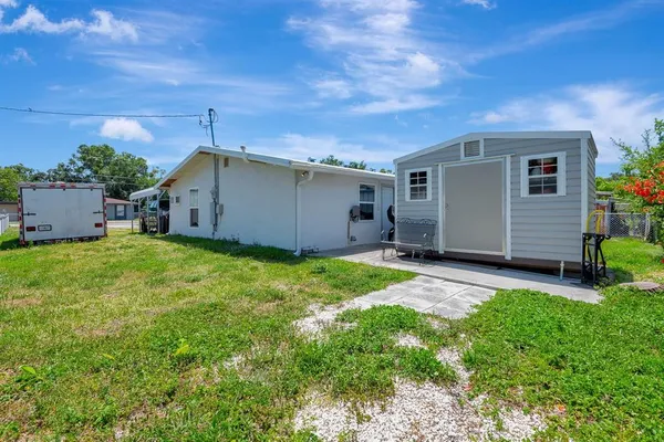 a view of a back yard of the house