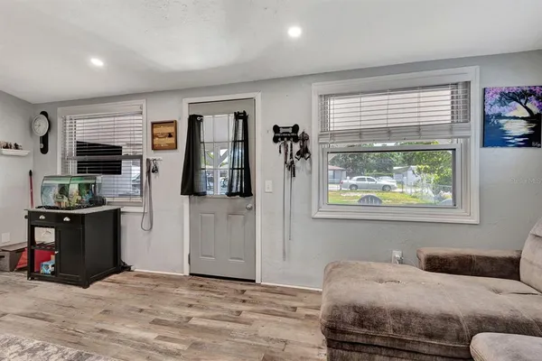 a living room with furniture and a window