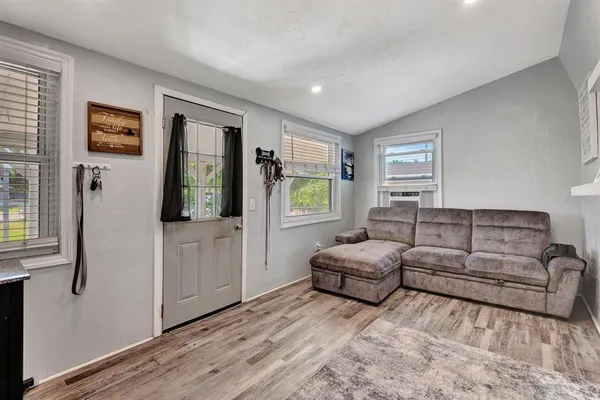 a kitchen with stainless steel appliances granite countertop a refrigerator stove a sink and a microwave