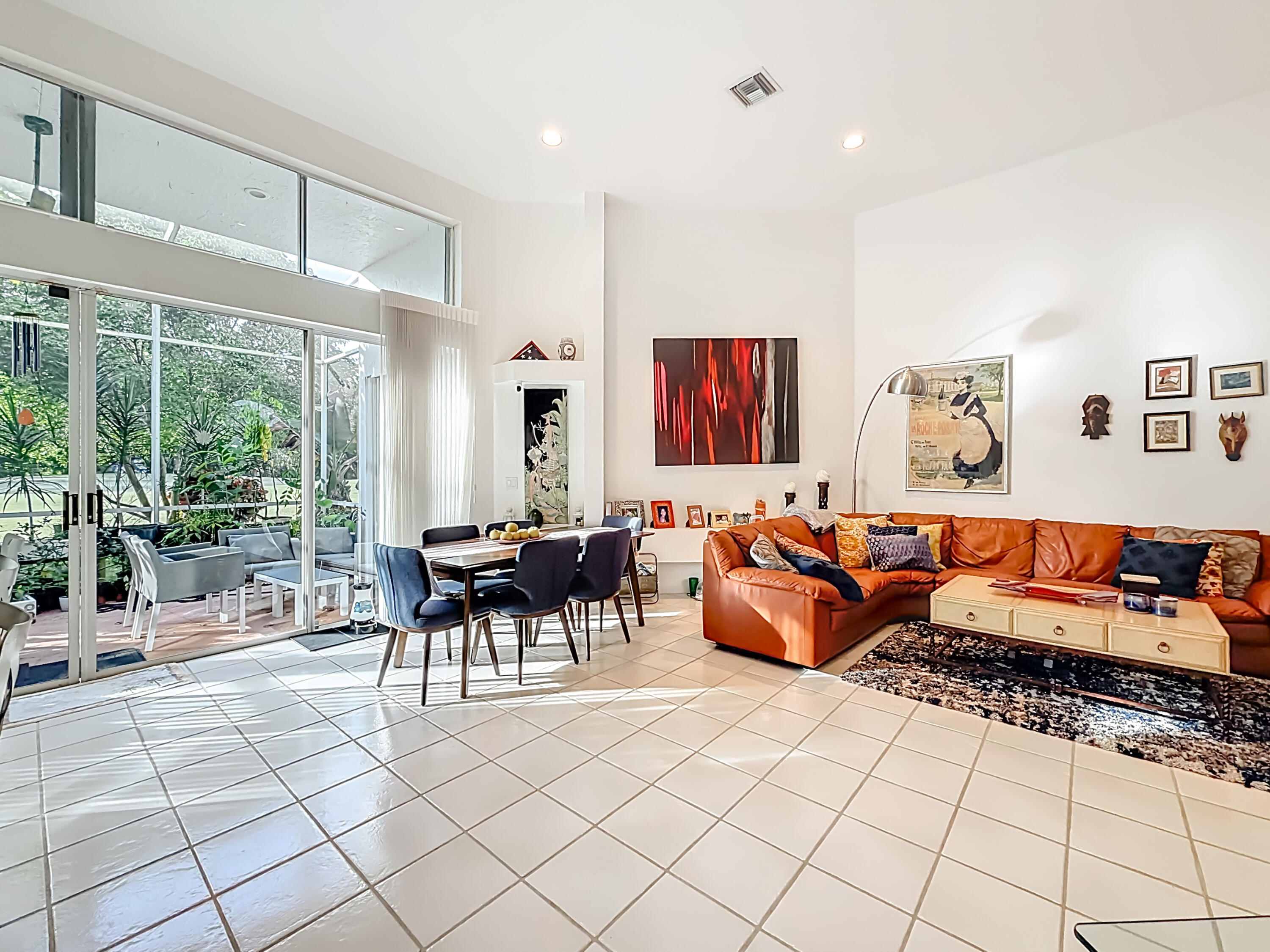 11853 Fountainside Circle Boynton Beach, FL 33437 - Photo 11 of 64 a living room with furniture and a floor to ceiling window