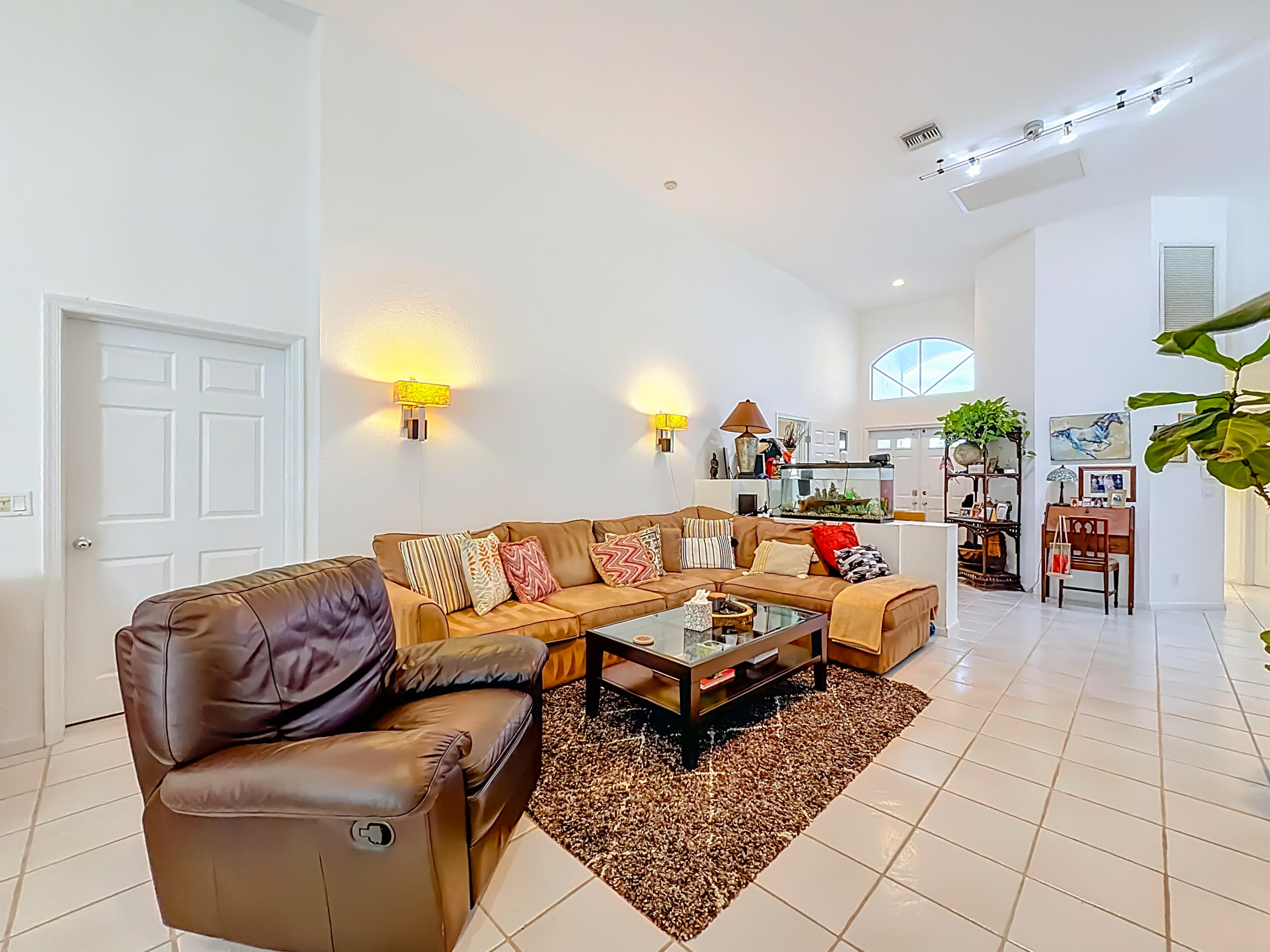 11853 Fountainside Circle Boynton Beach, FL 33437 - Photo 20 of 64 a living room with furniture and a chandelier
