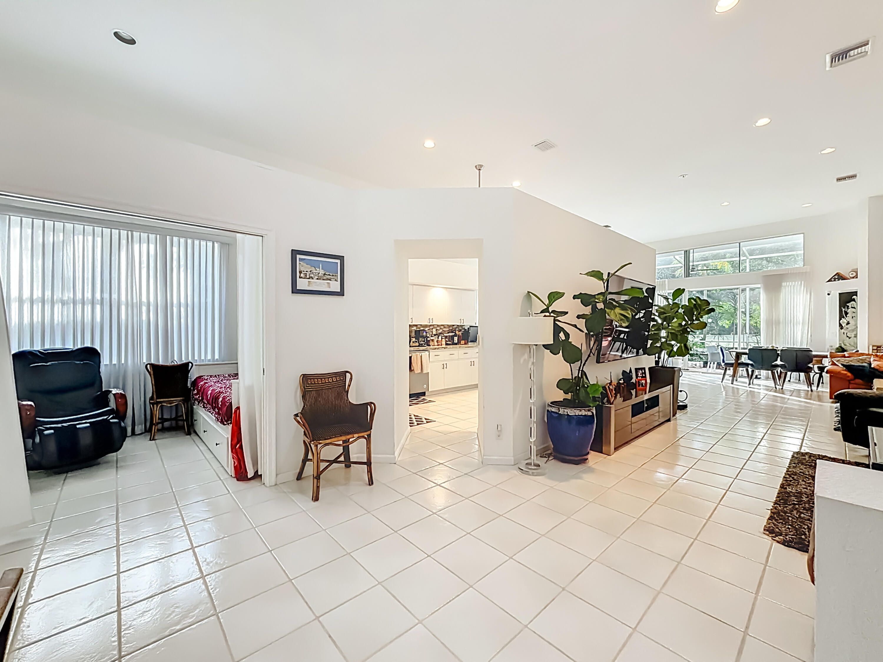 11853 Fountainside Circle Boynton Beach, FL 33437 - Photo 26 of 64 a living room with furniture gym equipment and a flat screen tv