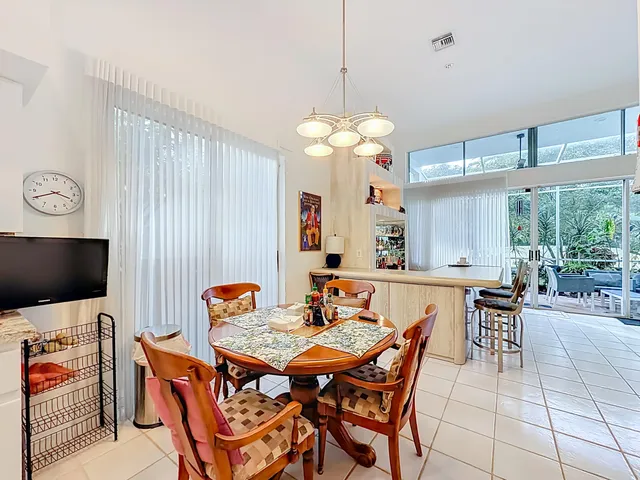 a bathroom with a sink vanity granite shower and a mirror