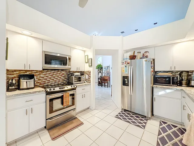 a bedroom with a bed and chair