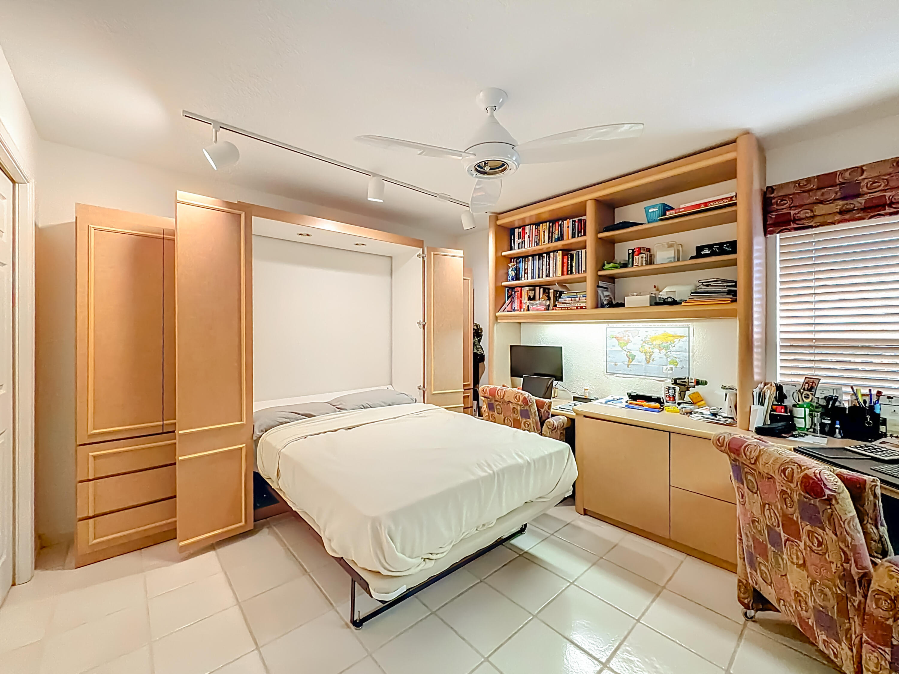 11853 Fountainside Circle Boynton Beach, FL 33437 - Photo 36 of 64 a bedroom with a bed and a large window