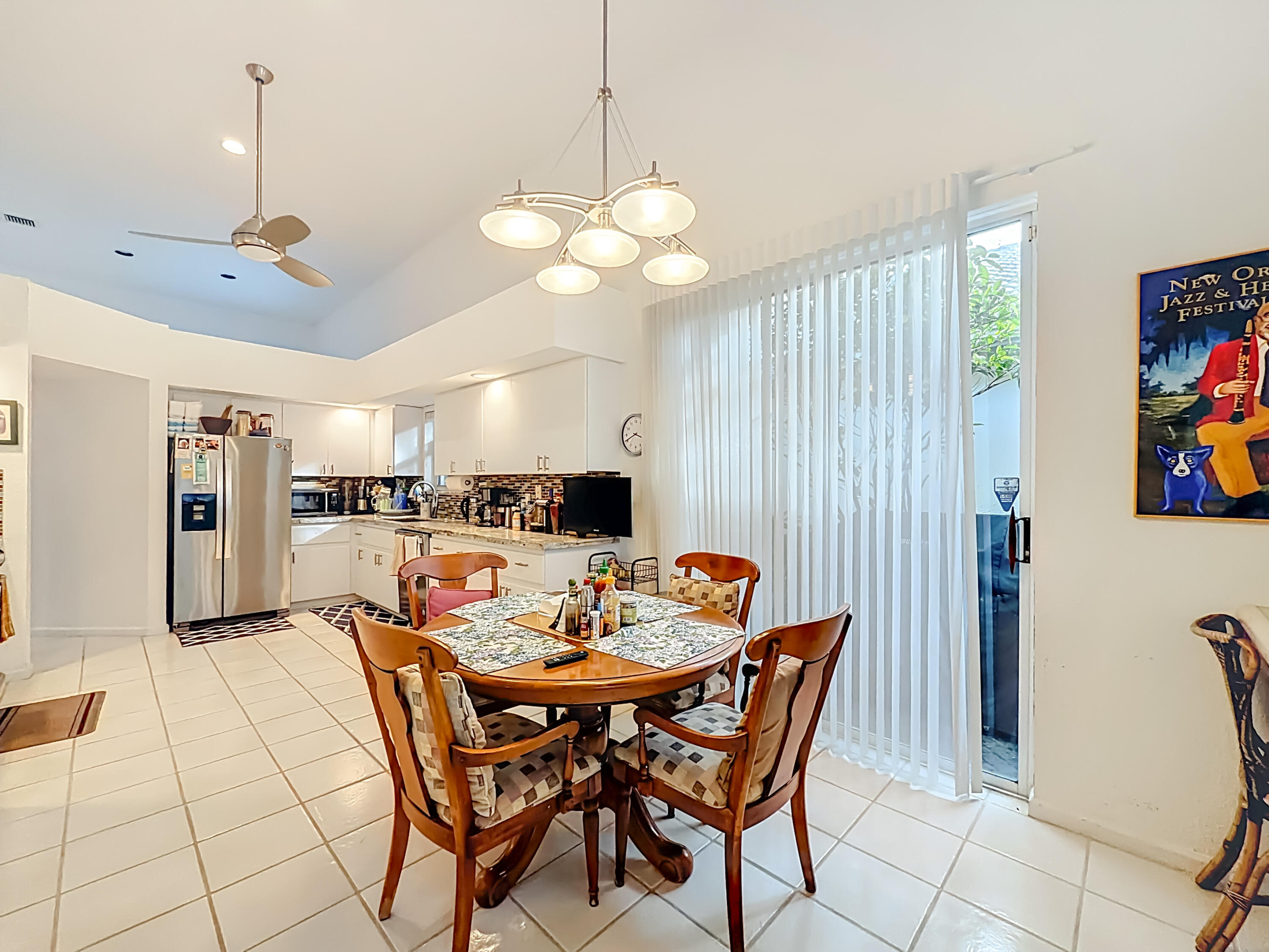11853 Fountainside Circle Boynton Beach, FL 33437 - Photo 46 of 64 a view of a dining room with furniture and chandelier