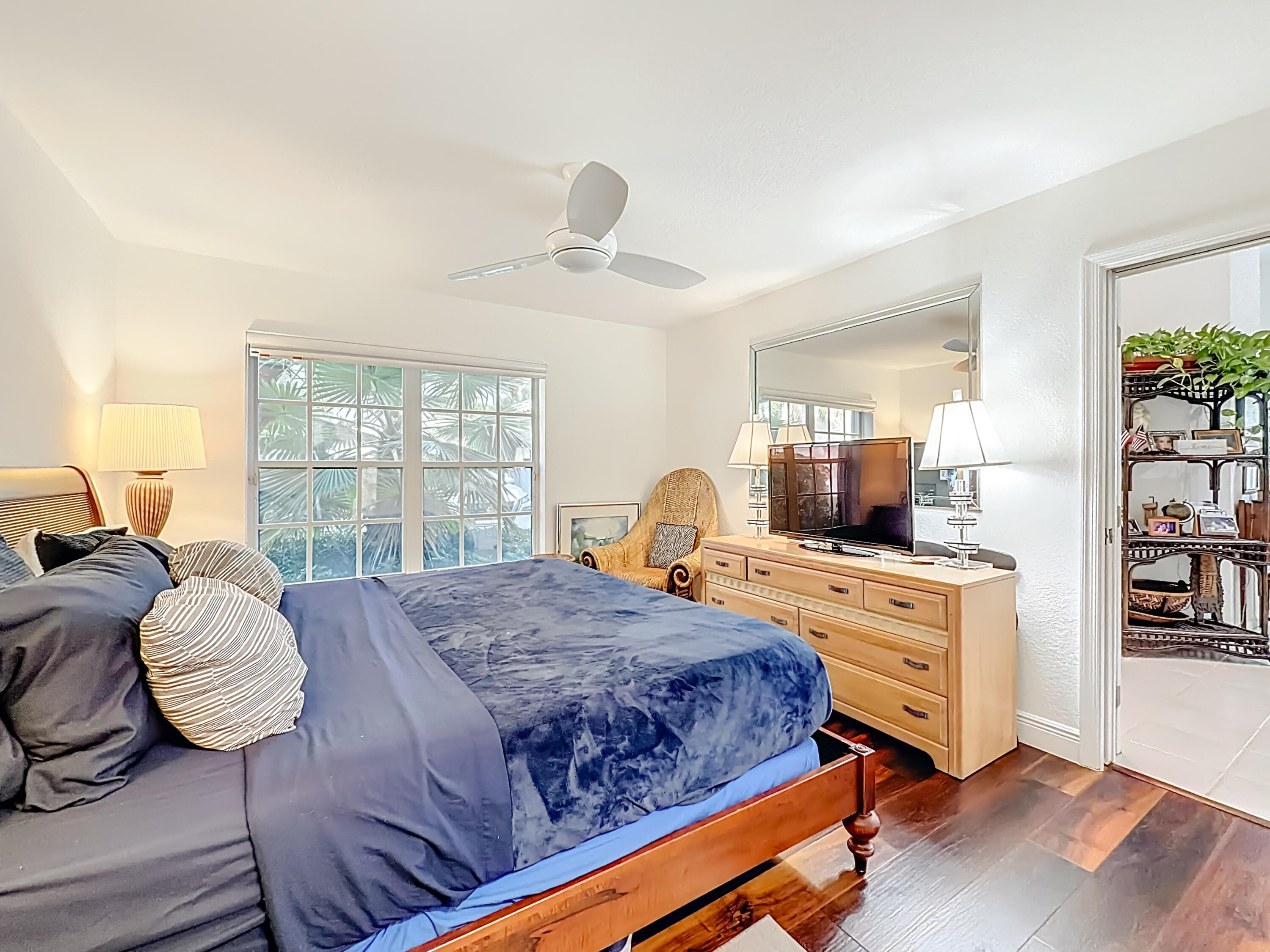 11853 Fountainside Circle Boynton Beach, FL 33437 - Photo 48 of 64 a bedroom with a bed and wooden floor