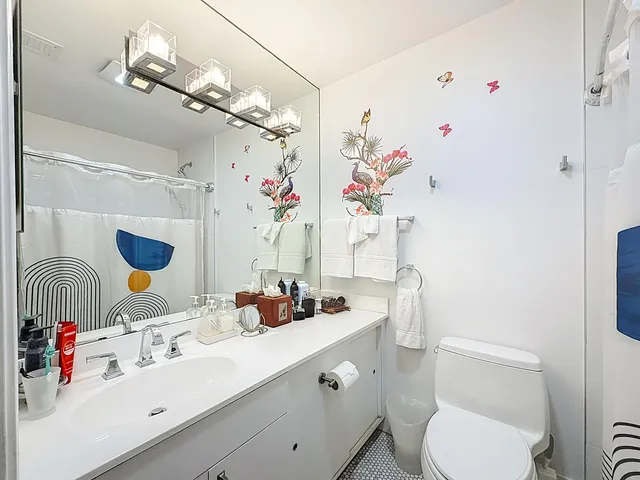 an aerial view of a house with swimming pool and lake view