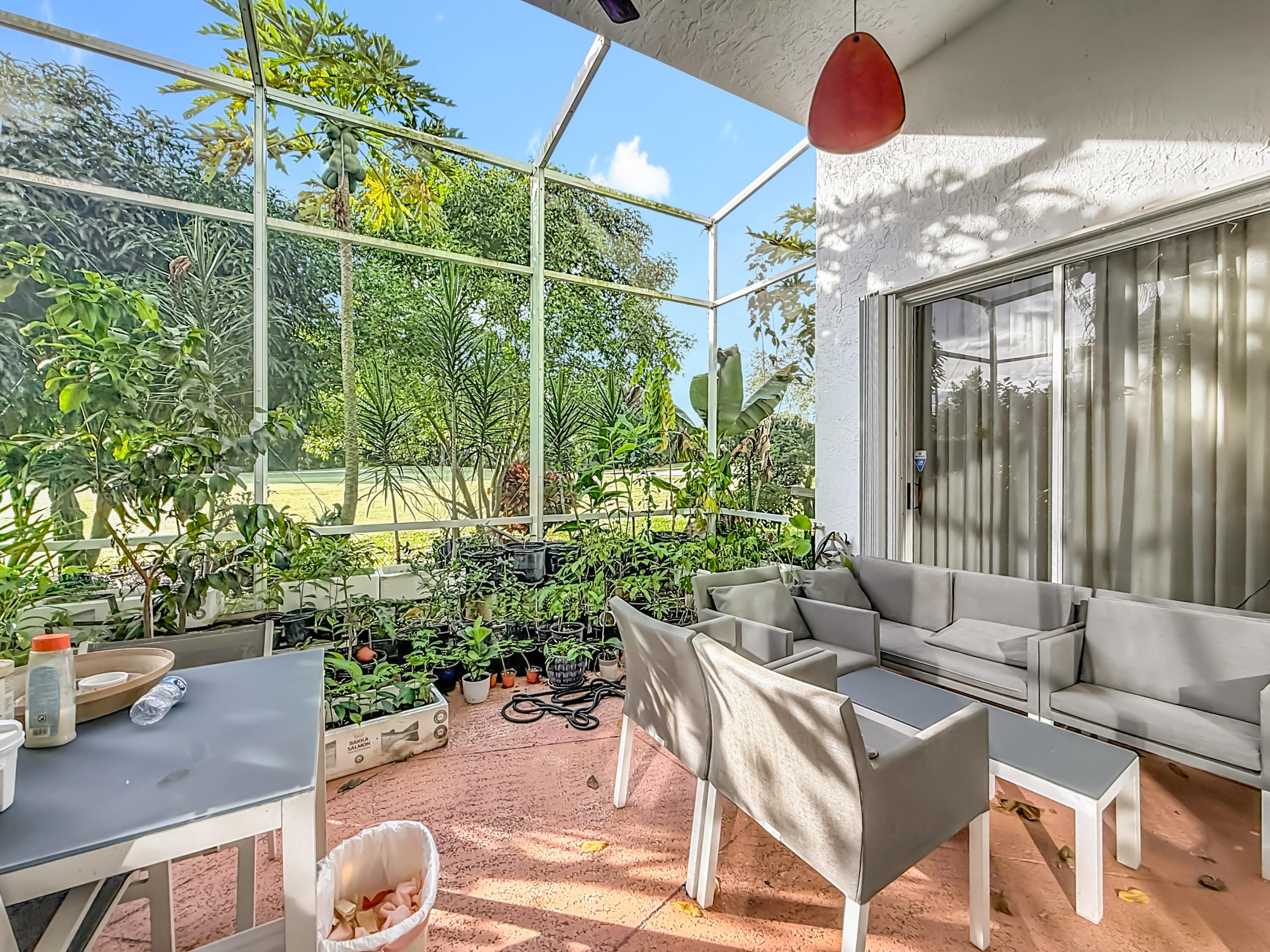 11853 Fountainside Circle Boynton Beach, FL 33437 - Photo 6 of 64 a living room filled with furniture and a potted plant