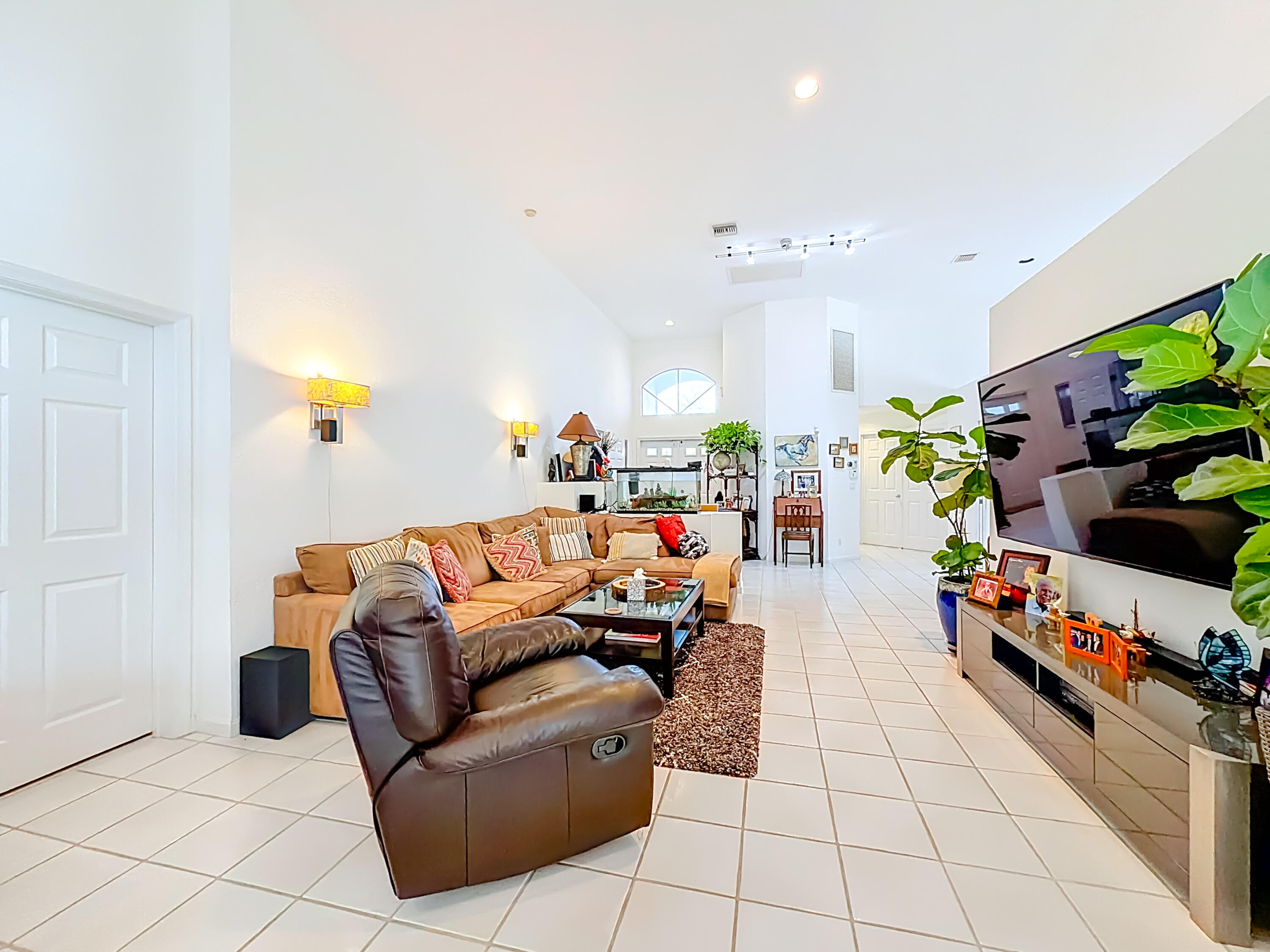 11853 Fountainside Circle Boynton Beach, FL 33437 - Photo 10 of 64 a living room with furniture and a flat screen tv