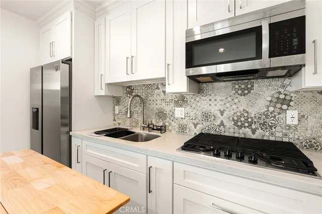 a kitchen with a sink and cabinets