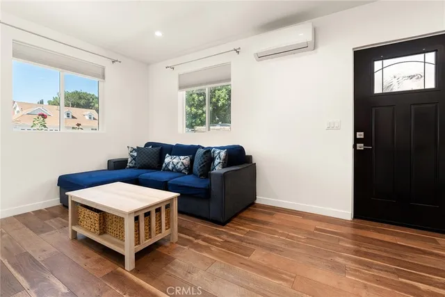 a living room with a couch and a window