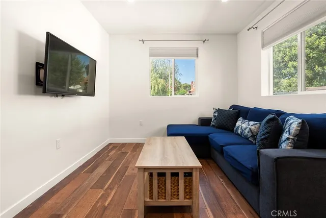 a living room with a couch and a flat screen tv