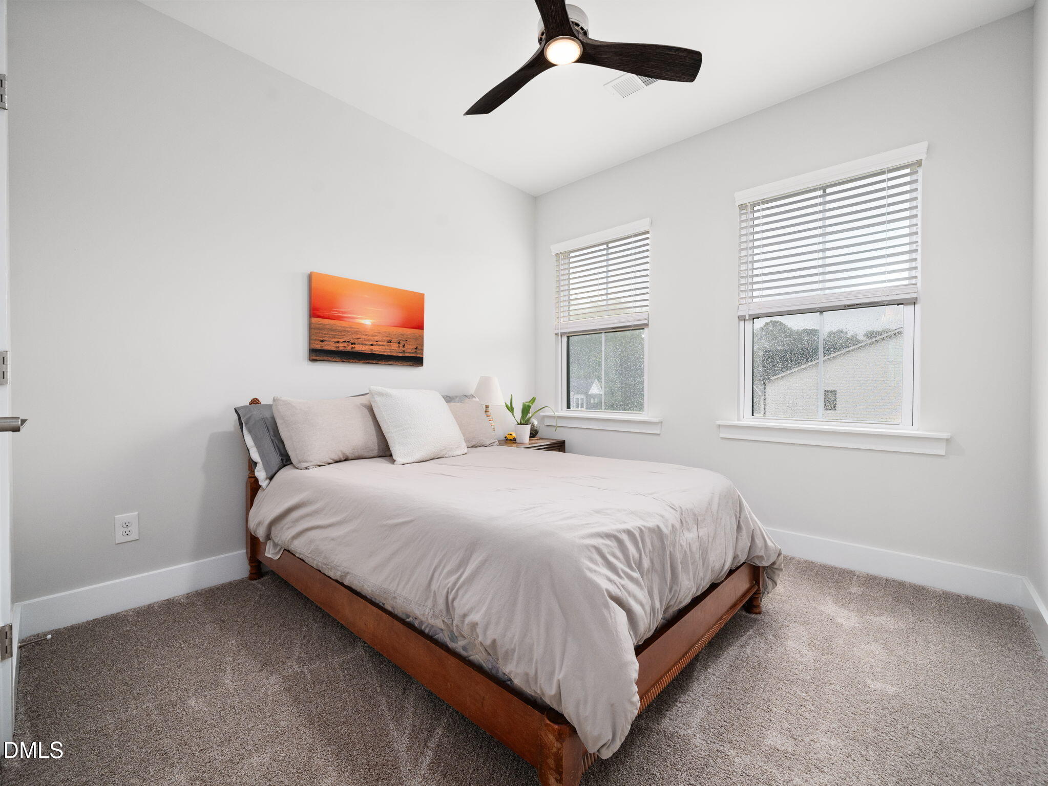 916 Waterside View Drive Raleigh, NC 27606 - Photo 20 of 22 a large bed sitting in a bedroom next to a window
