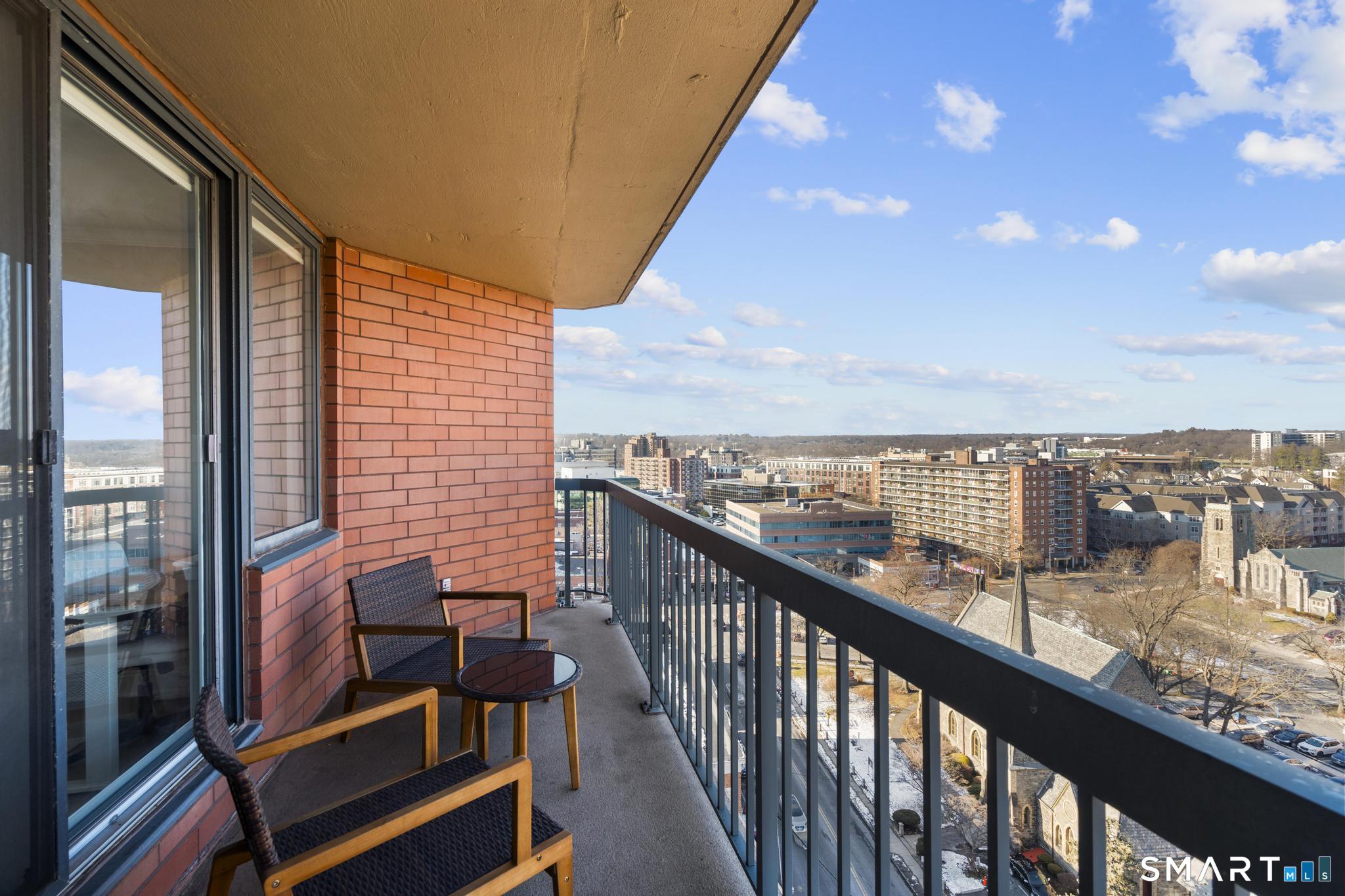 25 Forest Street, Unit 15E Stamford, CT 06901 - Photo 22 of 40 a view of city from a balcony