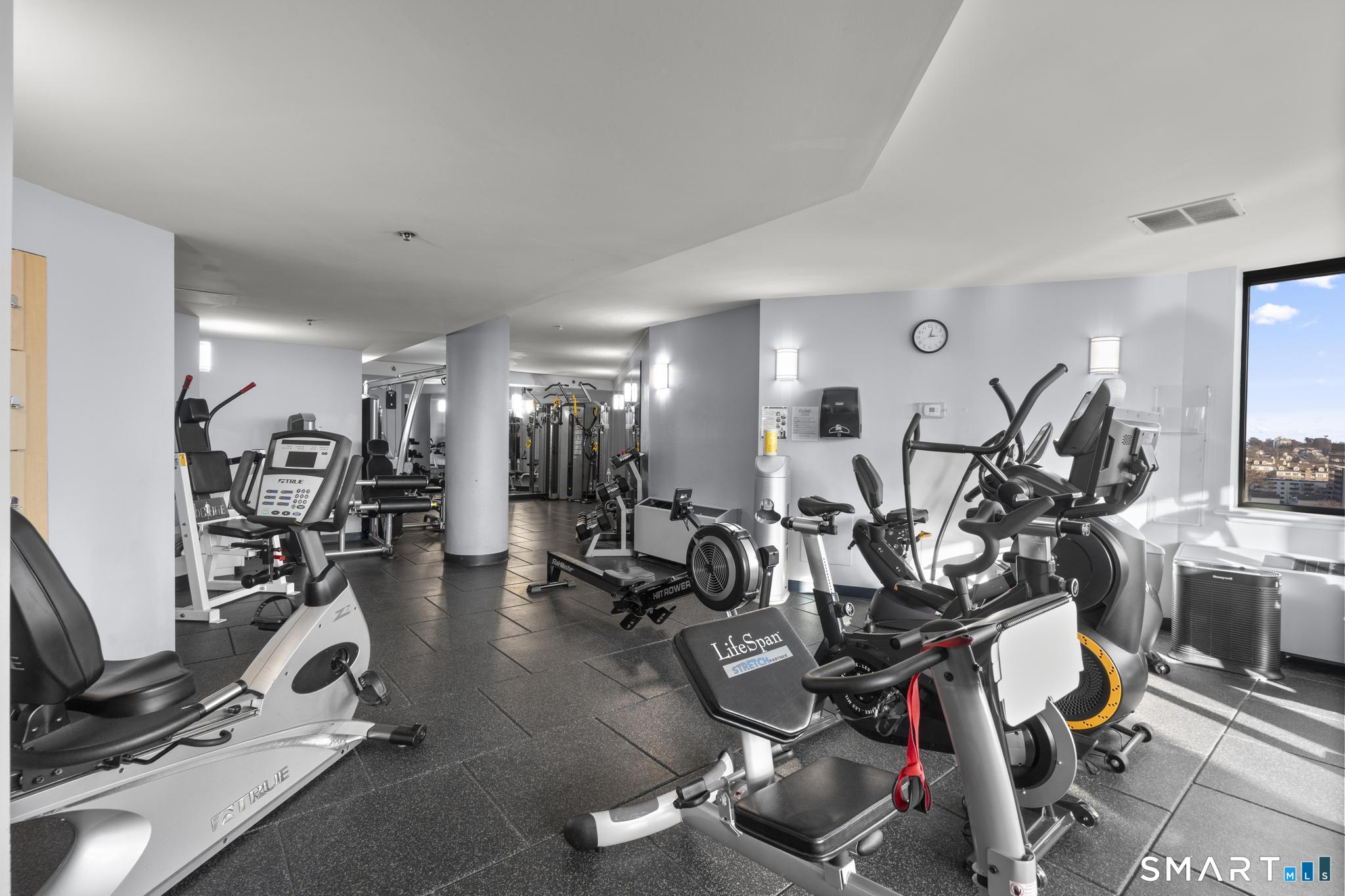 25 Forest Street, Unit 15E Stamford, CT 06901 - Photo 28 of 40 a view of a room with gym equipment