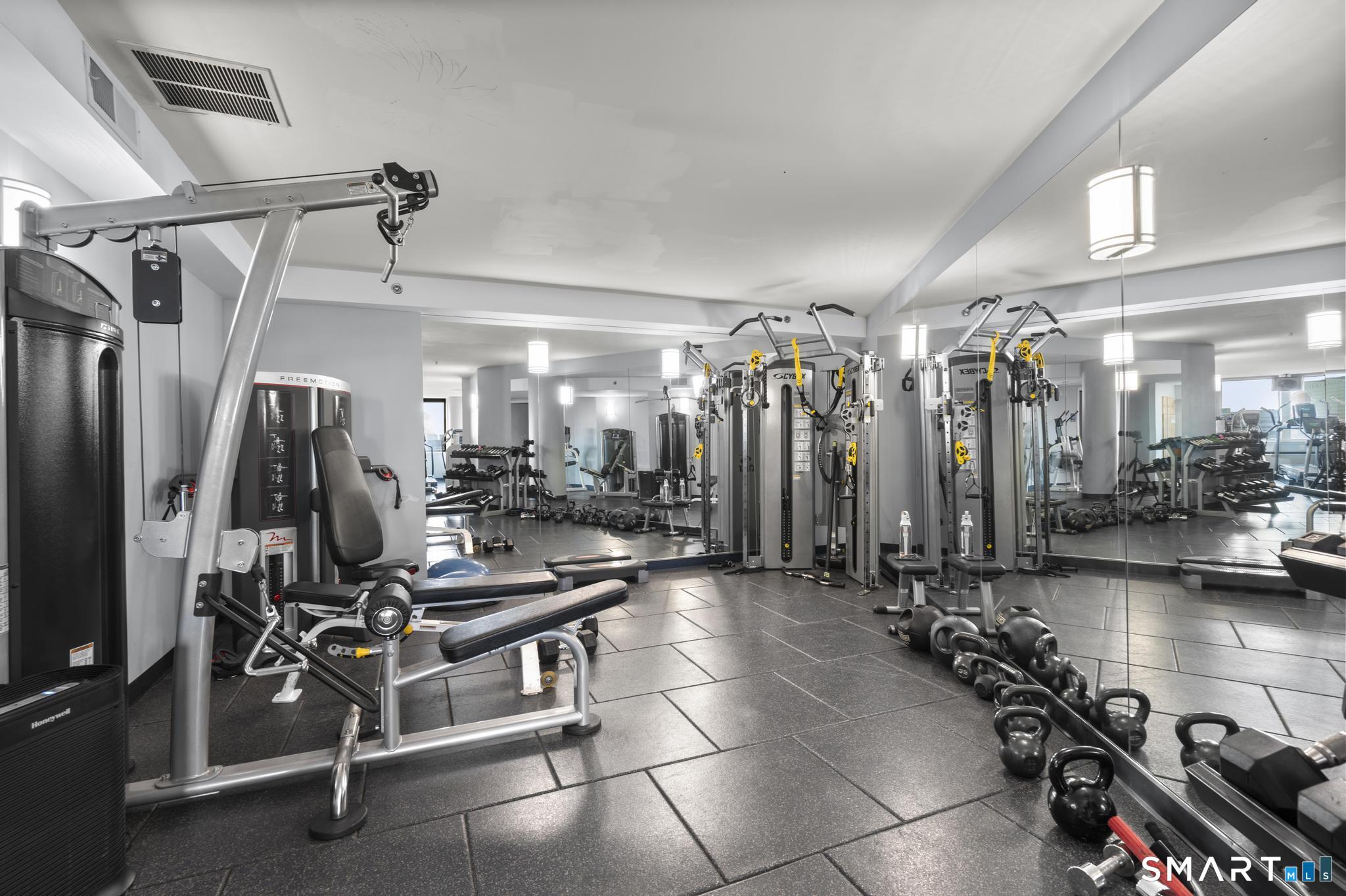 25 Forest Street, Unit 15E Stamford, CT 06901 - Photo 30 of 40 a view of a room with gym equipment