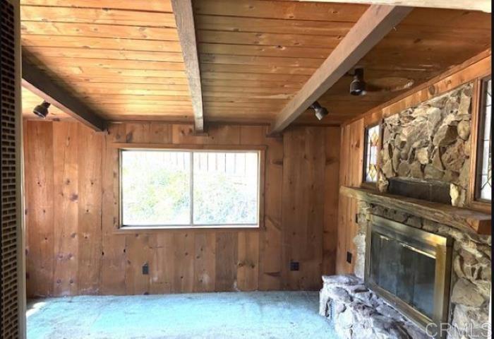 22021 Crestline Road Palomar Mountain, CA 92060 - Photo 11 of 15 a view of an empty room with a fireplace
