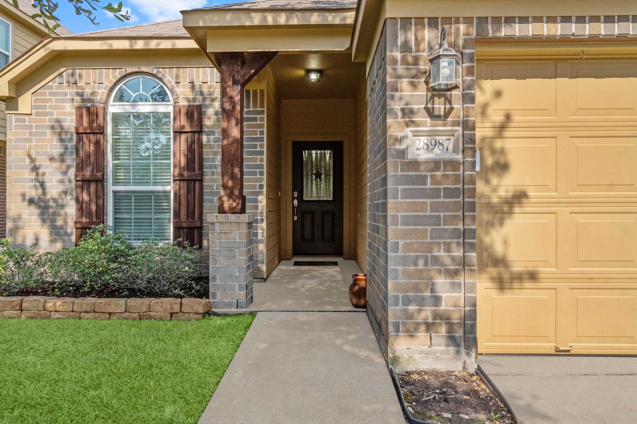 28987 Birch Green Way Spring, TX 77386 - Photo 32 of 32 a view of a brick house with a large windows