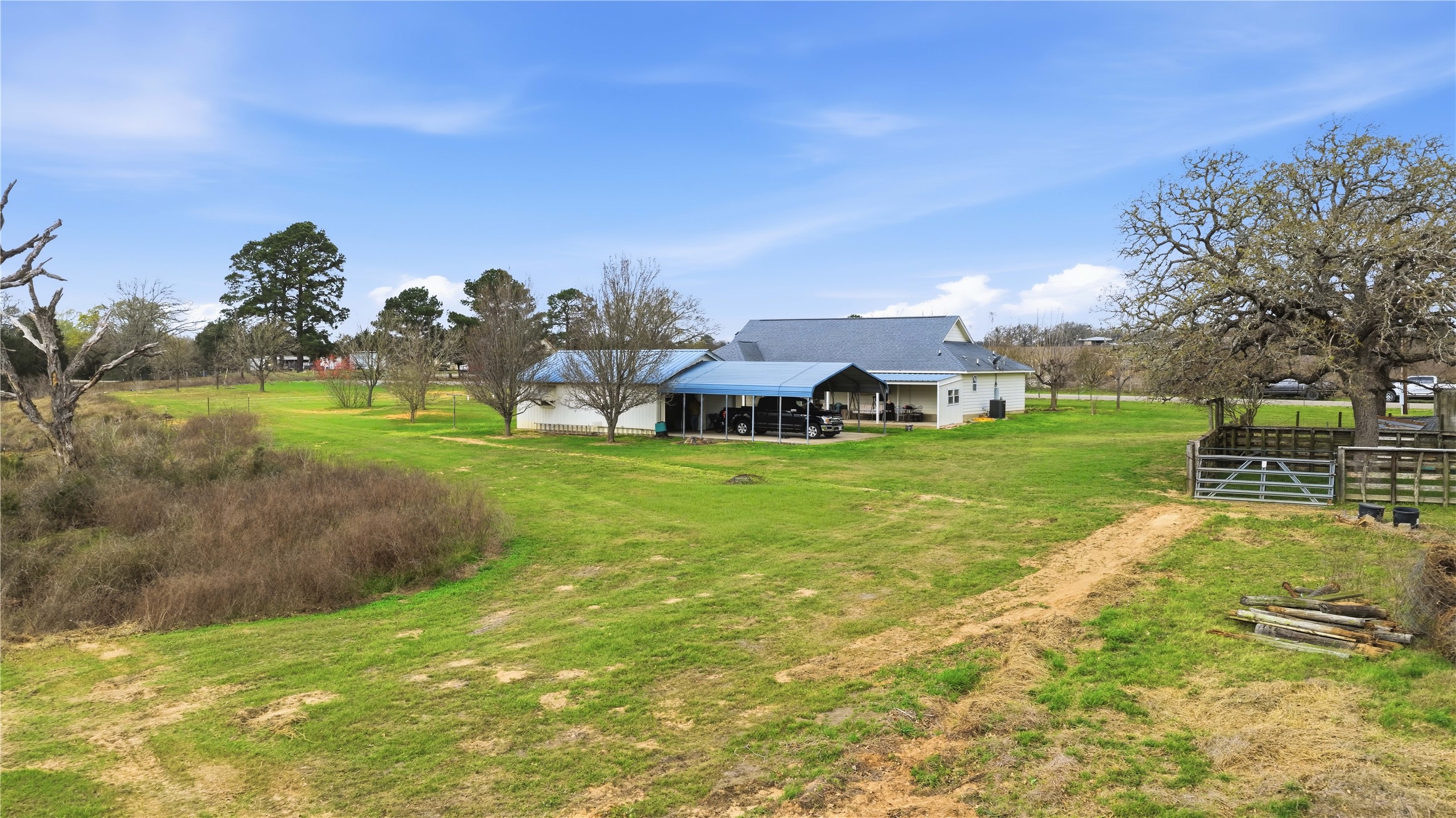 369 Young School House Road Smithville, TX 78957 - Photo 25 of 30 View of grassy yard featuring a sunroom