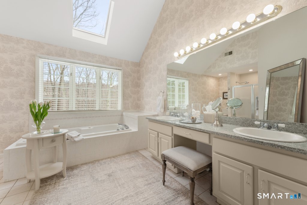 3 Owl Ridge Lane Sandy Hook, CT 06482 - Photo 13 of 40 a bathroom with a bathtub double sink and a mirror