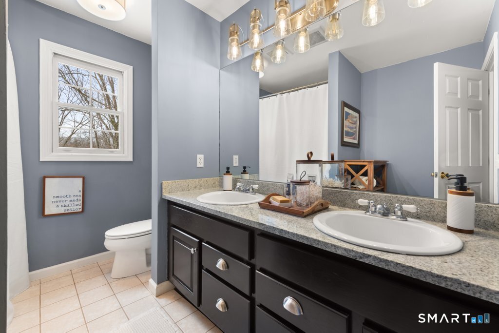 3 Owl Ridge Lane Sandy Hook, CT 06482 - Photo 15 of 40 a bathroom with a granite countertop sink a mirror a toilet and a window