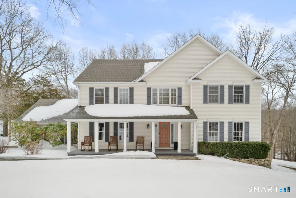 3 Owl Ridge Lane Sandy Hook, CT 06482 - Photo 16 of 40 a front view of a house with a yard