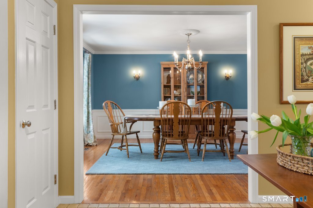 3 Owl Ridge Lane Sandy Hook, CT 06482 - Photo 20 of 40 a view of a dining room with furniture and chandelier