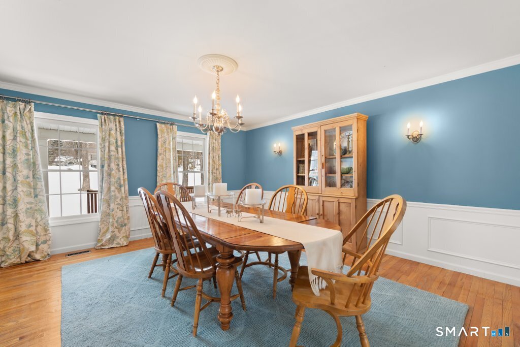 3 Owl Ridge Lane Sandy Hook, CT 06482 - Photo 21 of 40 a view of a dining room with furniture and chandelier