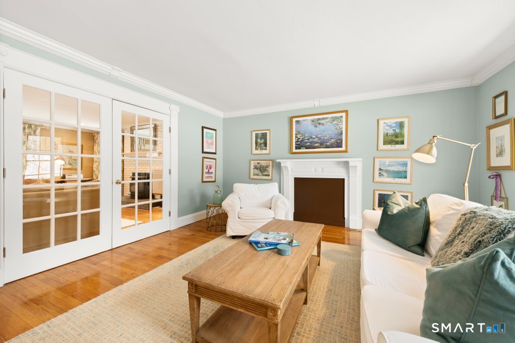 3 Owl Ridge Lane Sandy Hook, CT 06482 - Photo 23 of 40 a living room with furniture a fireplace and a large window