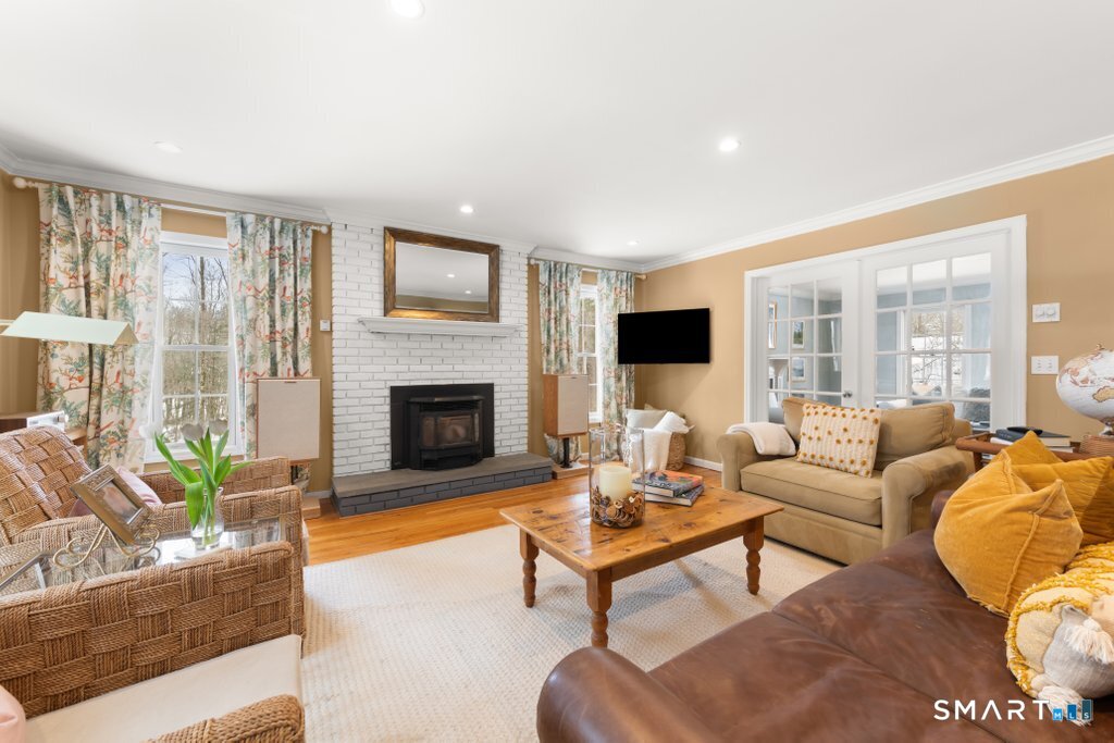 3 Owl Ridge Lane Sandy Hook, CT 06482 - Photo 30 of 40 a living room with furniture fireplace and a large window