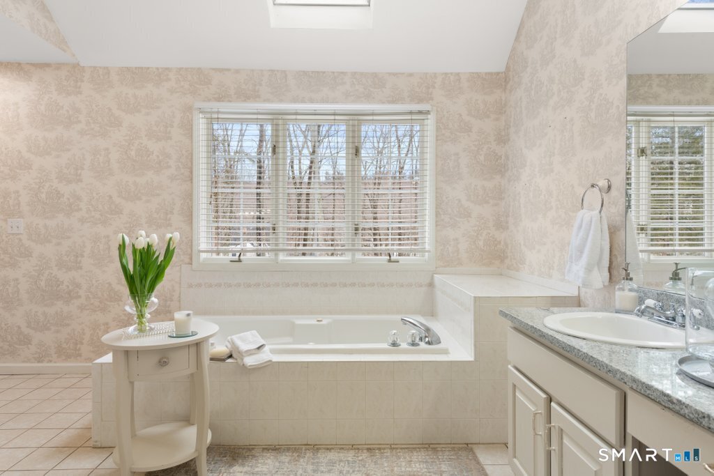3 Owl Ridge Lane Sandy Hook, CT 06482 - Photo 31 of 40 a bathroom with a granite countertop sink and a bathtub